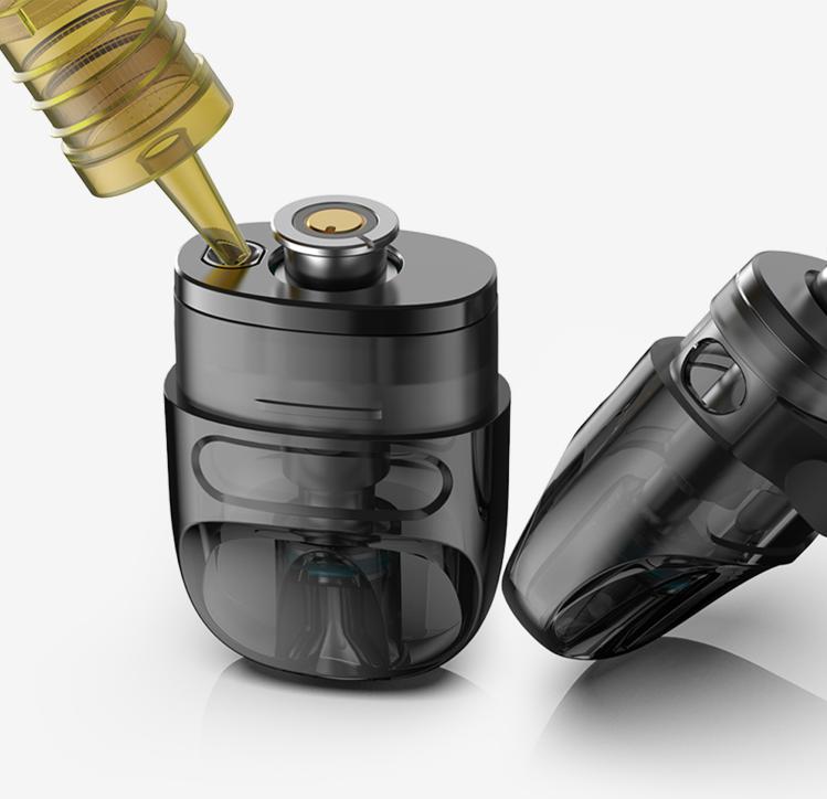 Image showing a Flexus Q replacement pod being refilled with e-liquid on the top filling port and another replacement pod beside it showing the additional side port