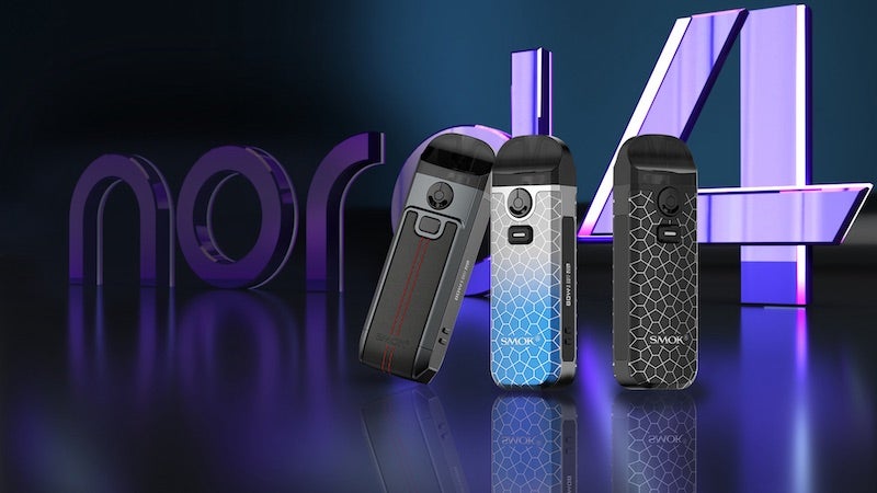 Image showing three Smok Nord 4 devices side by side with the side-display showing on the middle device